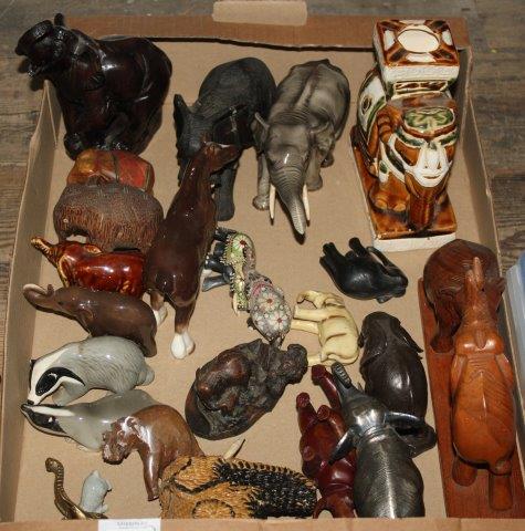 Collection of carved, ceramic and metal elephants and other animals